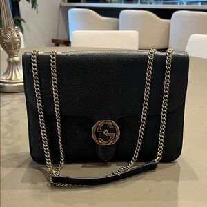 Gucci Black Leather Shoulder Bag with champagne color chain.